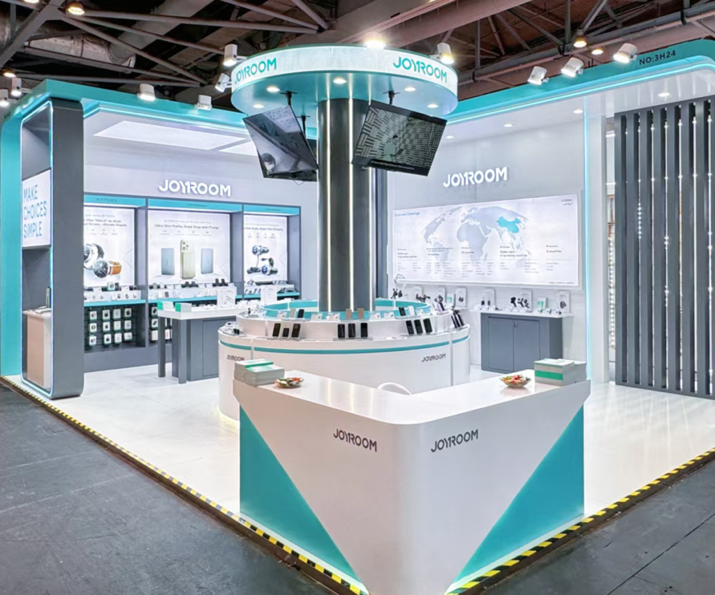 JOYROOM island style trade show booth with central column display and global business map wall