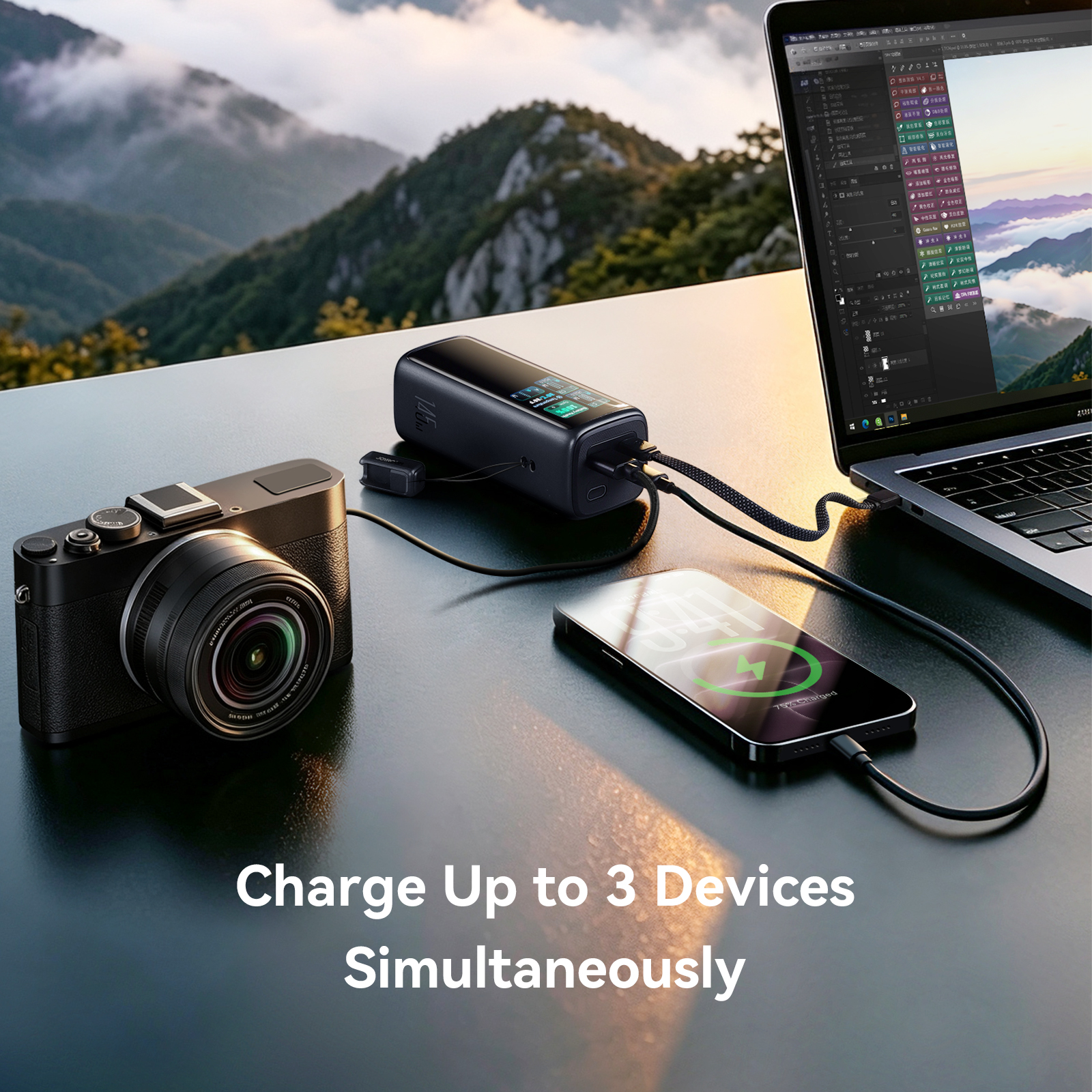PODIX PC50 145W 20000mAh power bank charging laptop, smartphone, and digital camera simultaneously on an outdoor table.