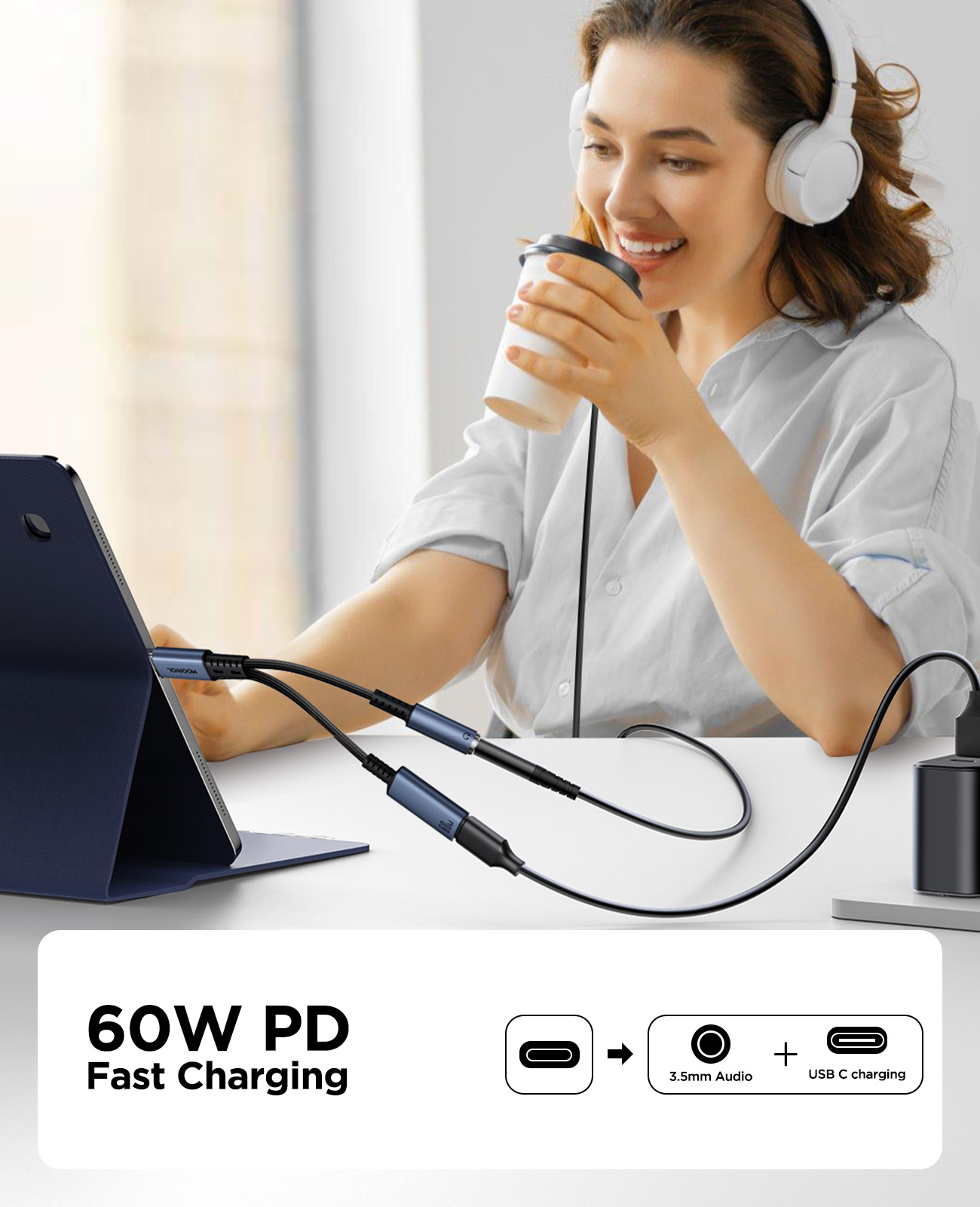 JOYROOM SY-C02 2-in-1 Type-C Audio Adapter connected to a tablet and 60W PD charger, allowing user to listen to music with 3.5mm headphones while fast charging